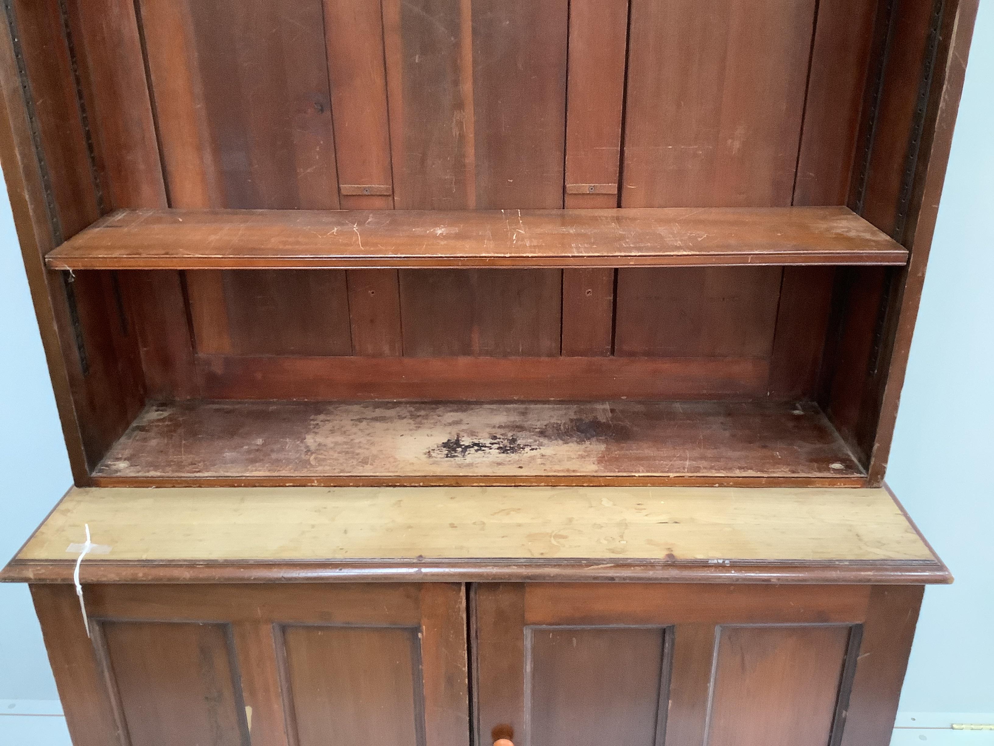 A Victorian mahogany bookcase cupboard, width 127cm, depth 47cm, height 221cm